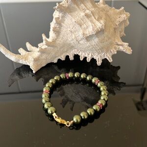 Handmade green beads with pink crystal and gold hardware